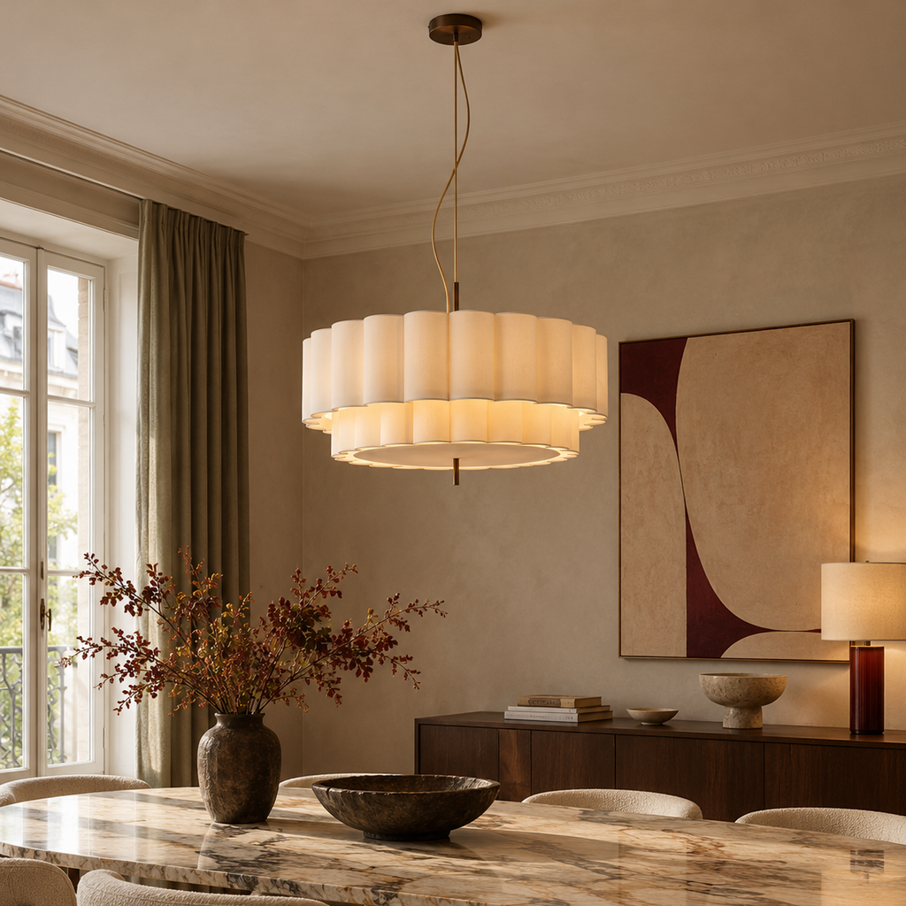 Two-tier pleated fabric chandelier above a marble dining table