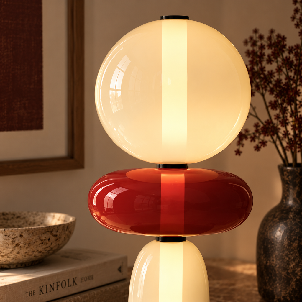 Stacked glass totem table lamp on a desk