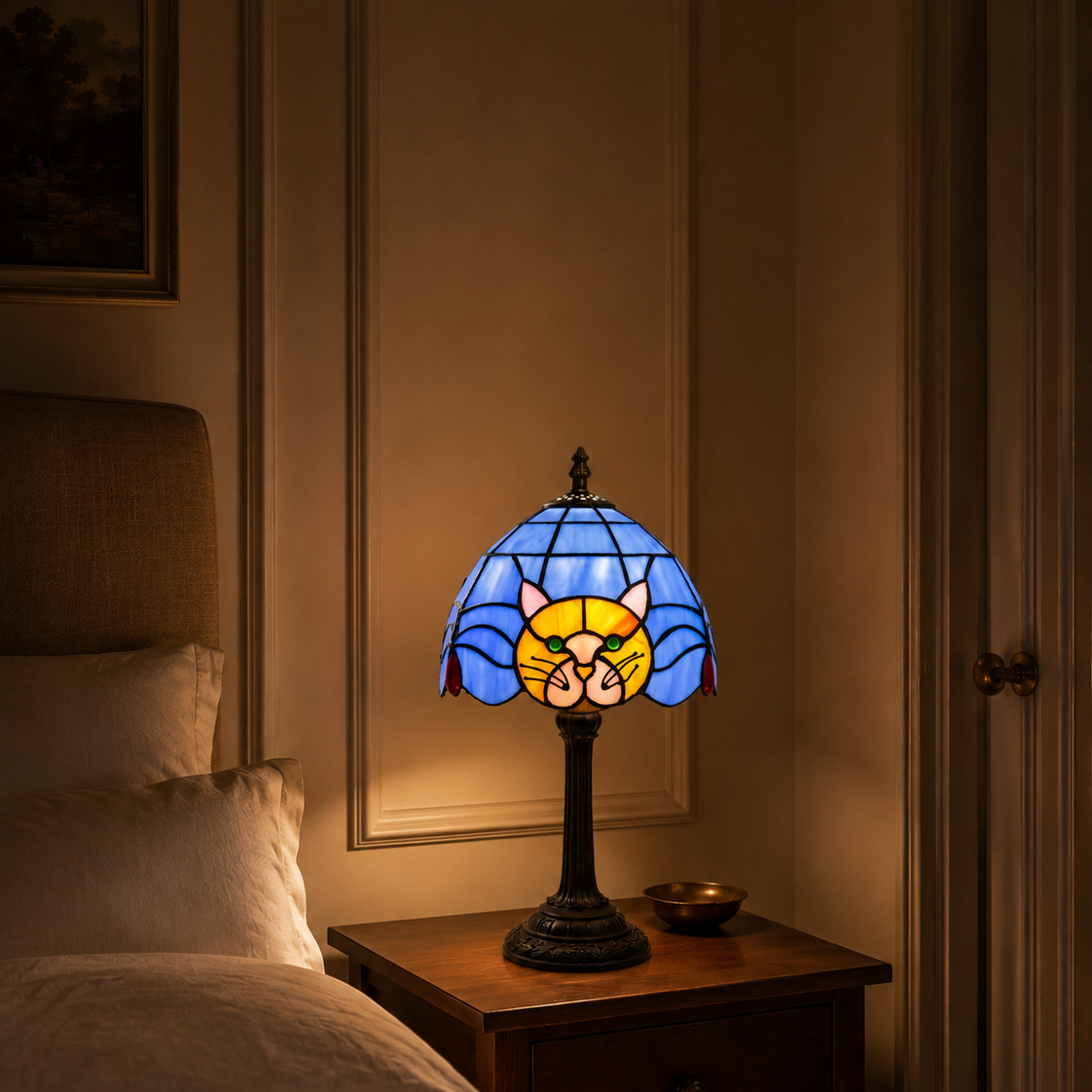 Stained-glass black cat table lamp on a bedside table