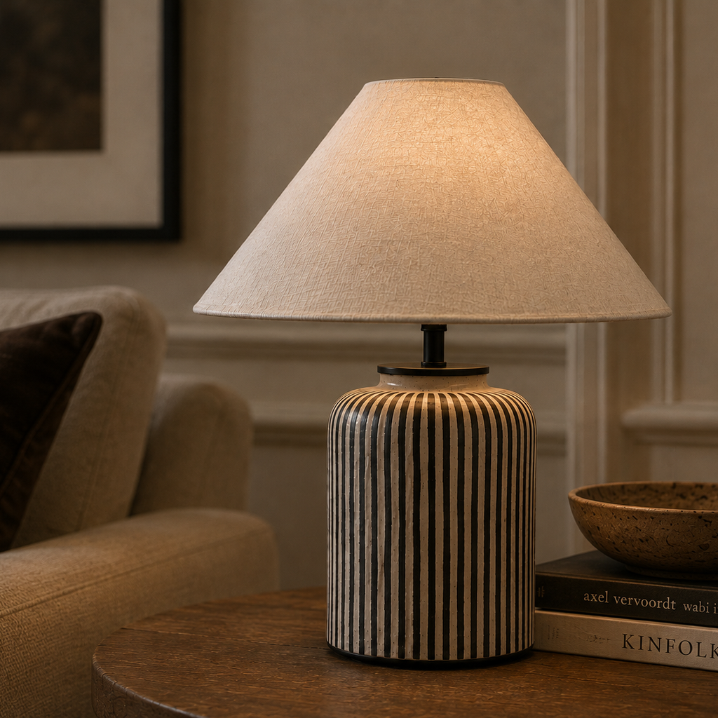 Close view of the striped ceramic table lamp and its coolie shade