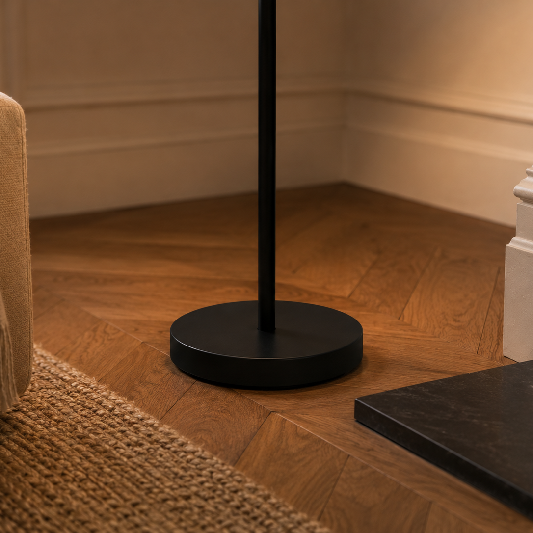 Close view of the pebble floor lamp's base on a woven rug