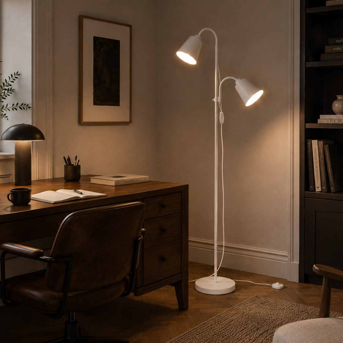 White two-head floor lamp beside a walnut desk in a home office