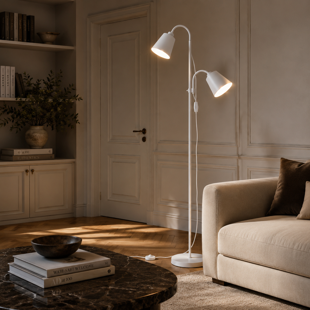 White two-head floor lamp beside a linen armchair in a period living room