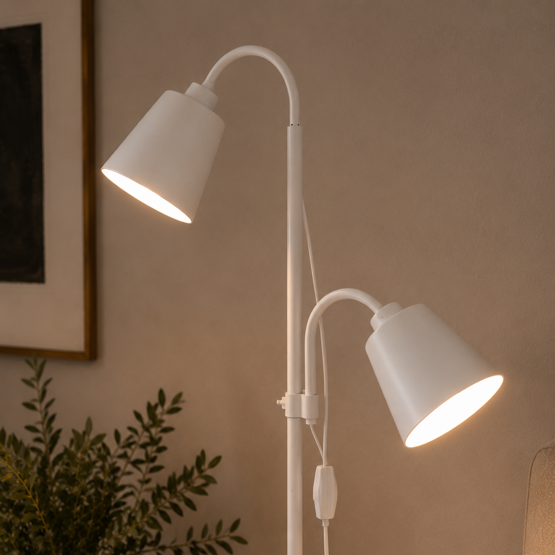Close view of the white two-head floor lamp's adjustable shades